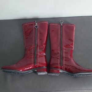 Red Heeled Boots with Sleek Zipper Design